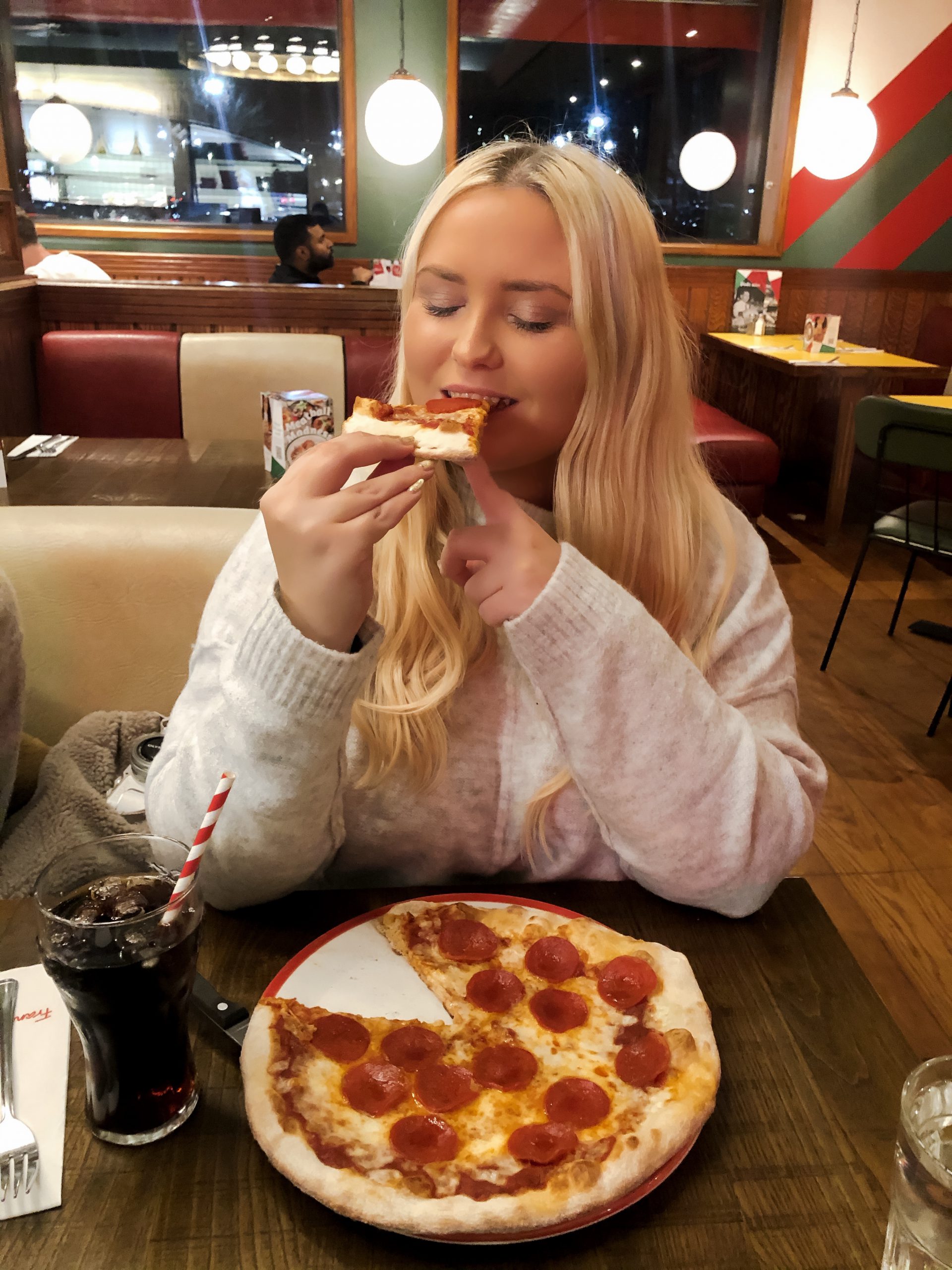 Eating pizza at Frankie and Benny's Meridian. 